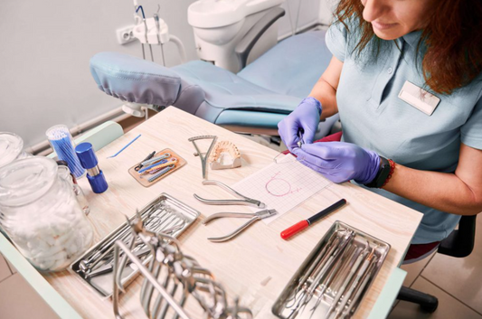 Image shows dentist setting up dental supplies